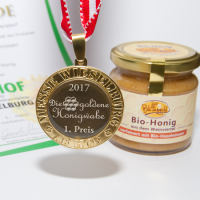 Honigglas und Goldmedaille